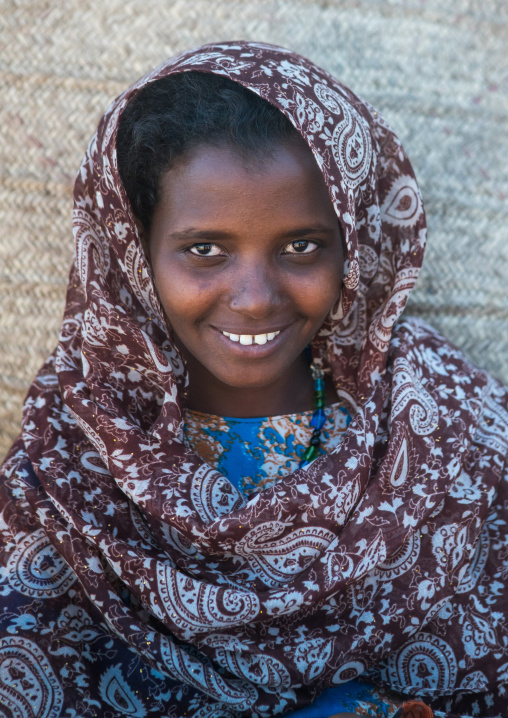 Portrait of a smiling afar tribe teenage girl, Afar region, Afambo, Ethiopia