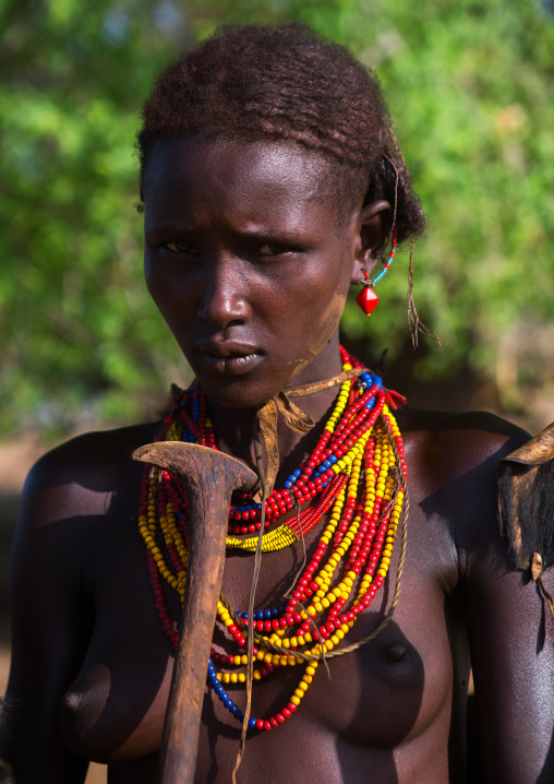 Portrait of a dassanech tribe woman during dimi ceremony, Omo valley, Omorate, Ethiopia