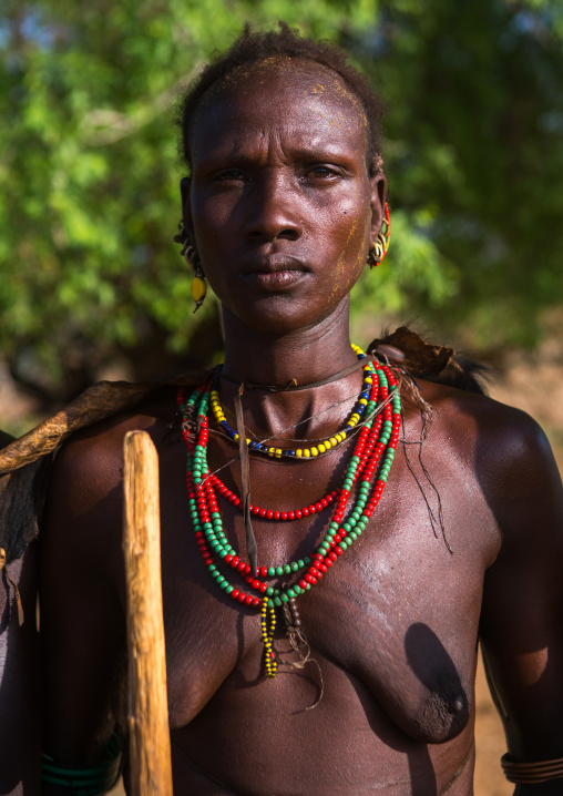 Portrait of a dassanech tribe woman during dimi ceremony, Omo valley, Omorate, Ethiopia