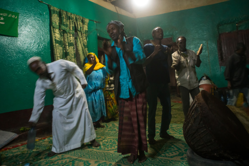 Sufi people go into a trance during a ceremony, Harari region, Harar, Ethiopia