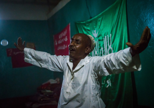 Sufi man goes into a trance during a ceremony, Harari region, Harar, Ethiopia