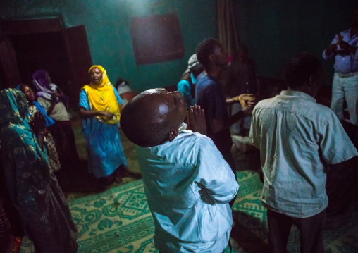 Sufi people go into a trance during a ceremony, Harari region, Harar, Ethiopia