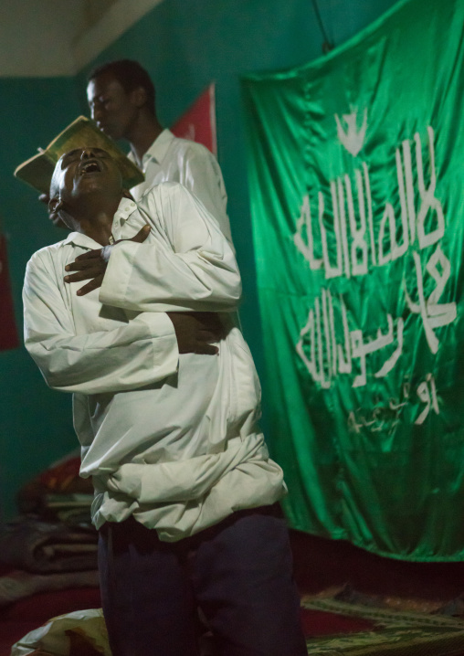 Sufi people go into a trance during a ceremony, Harari region, Harar, Ethiopia