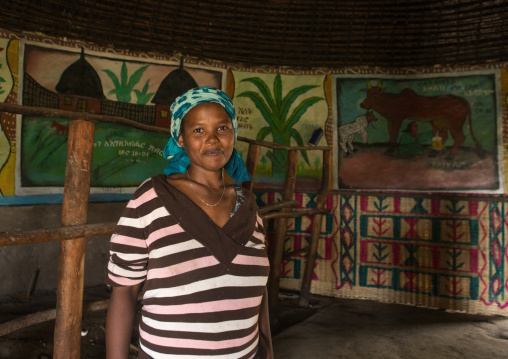 Ethiopia, Kembata, Alaba Kuito, ethiopian woman inside her traditional painted and decorated house