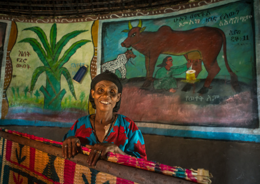 Ethiopia, Kembata, Alaba Kuito, ethiopian woman inside her traditional painted and decorated house