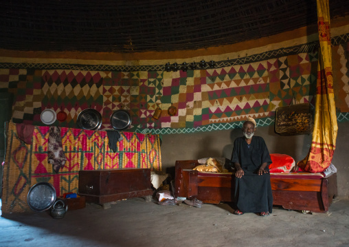 Ethiopia, Kembata, Alaba Kuito, ethiopian muslim man inside his traditional painted and decorated house