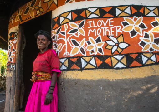 Ethiopia, Kembata, Alaba Kuito, ethiopian woman standing in front of her traditional painted house