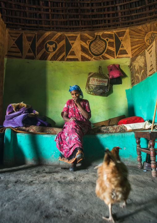 Ethiopia, Kembata, Alaba Kuito, ethiopian woman inside her traditional painted and decorated house