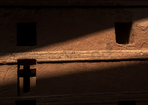 Monolithic rock-cut church lit by a ray of sun, Amhara region, Lalibela, Ethiopia