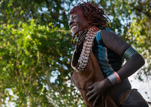 Hamer tribe women dancing during a bull jumping ceremony, Omo valley, Turmi, Ethiopia