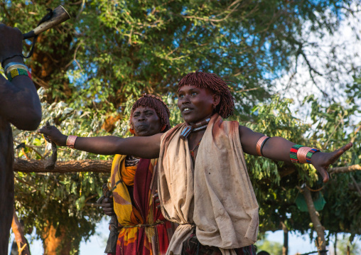 Hamer tribe woman waiting to be whipped during a bull jumping ceremony, Omo valley, Turmi, Ethiopia