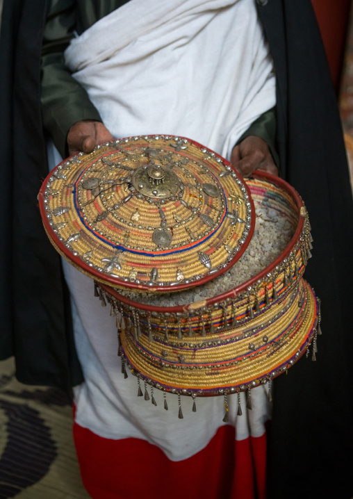 Ethiopian orthodox priest with an insence basket in nakuto lab rock church, Amhara region, Lalibela, Ethiopia