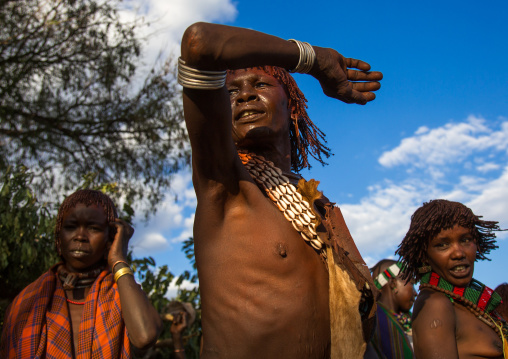 Hamer tribe women dancing during a bull jumping ceremony, Omo valley, Turmi, Ethiopia