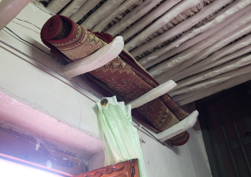 Rolled carpet above the main door of an house to indicate a single girl is available for marriage, Harari Region, Harar, Ethiopia