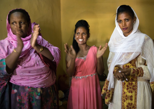 Women clapping during an orthodox wedding ceremony, Afar region, Assaita, Ethiopia