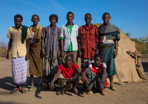 Portrait of Afar tribe men in front of their traditional hut, Afar region, Afambo, Ethiopia