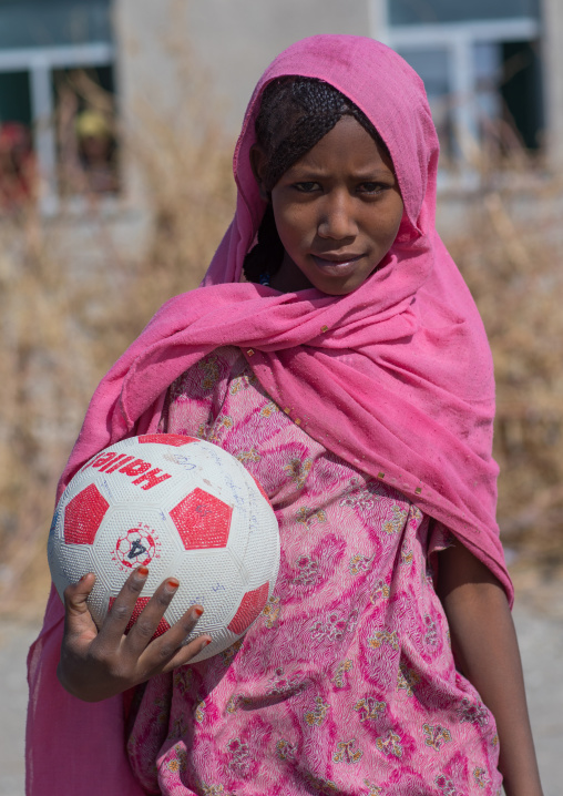 Portrait of an Afar tribe girl in pink veil with a ball, Afar region, Semera, Ethiopia