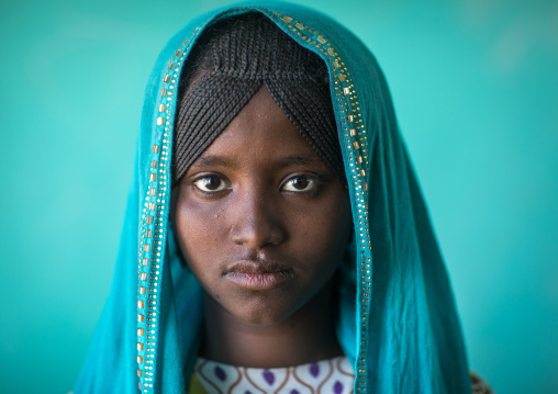 Portrait of an Afar tribe girl with braided hair and a blue veil, Afar region, Semera, Ethiopia