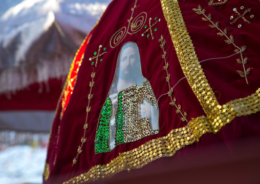 Jesus on an umbrella during the colorful Timkat epiphany festival, Amhara region, Lalibela, Ethiopia