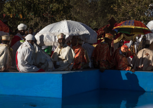 Priests in front of the pool during Timkat celebrations of epiphany, Amhara region, Lalibela, Ethiopia