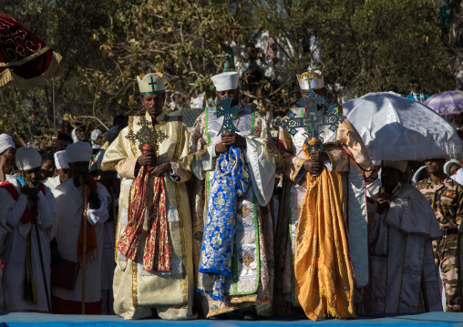 Priests in front of the pool blessing the holy water during Timkat celebrations of epiphany, Amhara region, Lalibela, Ethiopia