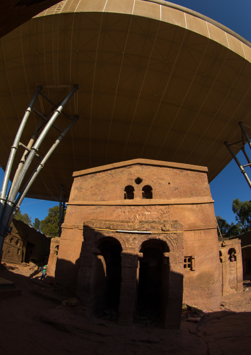 Protective shelters over a monolithic rock-cut church, Amhara region, Lalibela, Ethiopia