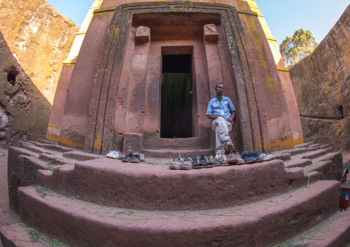 Tourists shoes in the monolithic rock-cut church of st. George, Amhara region, Lalibela, Ethiopia