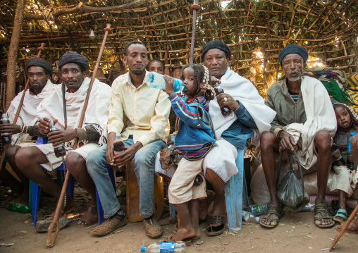 Men inside a traditional hut during the Gada system ceremony in Borana tribe, Oromia, Yabelo, Ethiopia