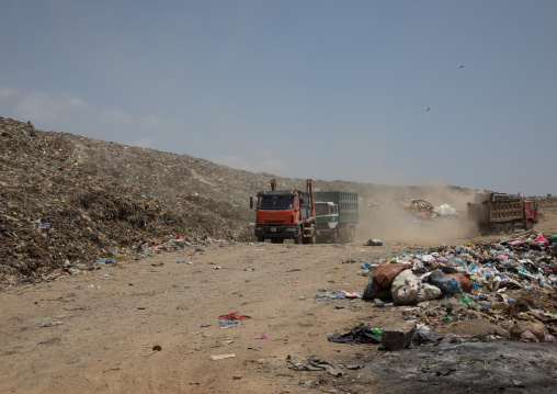 Trucks in Koshe rubbish dump, Addis Ababa region, Addis Ababa, Ethiopia