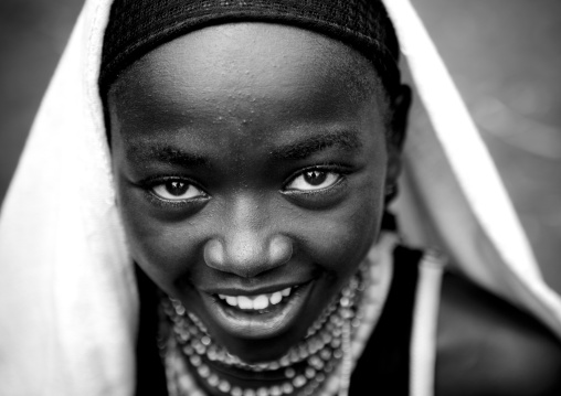 Veiled dizi girl, Tum market, Omo valley, Ethiopia