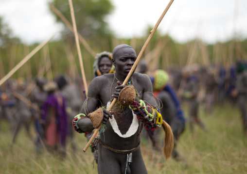 Suri tribe warriors fighting during a donga stick ritual, Omo valley, Tulgit, Ethiopia