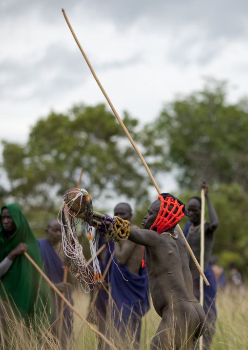 Suri tribe warriors fighting during a donga stick ritual, Omo valley, Tulgit, Ethiopia