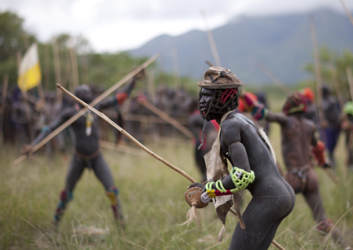 Suri tribe warriors fighting during a donga stick ritual, Omo valley, Tulgit, Ethiopia