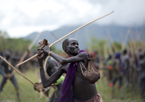 Suri tribe warriors fighting during a donga stick ritual, Omo valley, Tulgit, Ethiopia