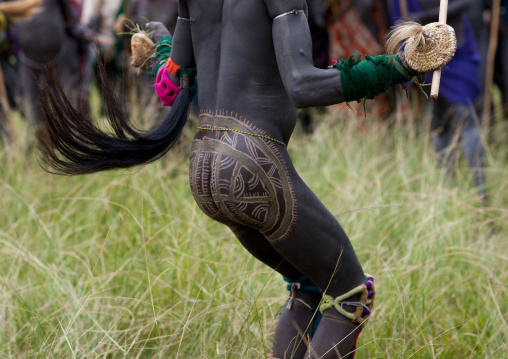 Suri tribe warriors fighting during a donga stick ritual, Omo valley, Tulgit, Ethiopia