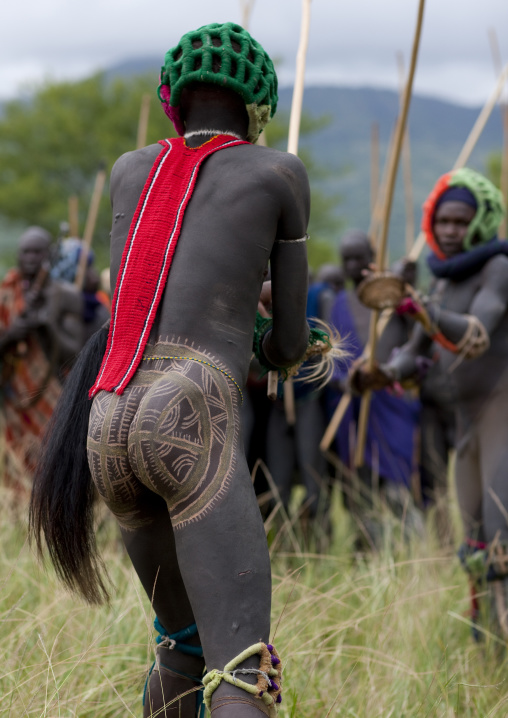 Suri tribe warriors fighting during a donga stick ritual, Omo valley, Tulgit, Ethiopia