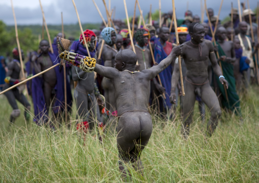 Suri tribe warriors fighting during a donga stick ritual, Omo valley, Tulgit, Ethiopia