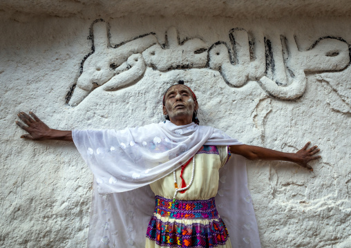 Oromo pilgrim woman in Sheikh Hussein shrine with jarawa powder on the face, Oromia, Sheik Hussein, Ethiopia