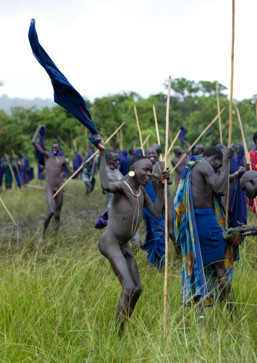 Suri tribe warriors fighting during a donga stick ritual, Omo valley, Tulgit, Ethiopia