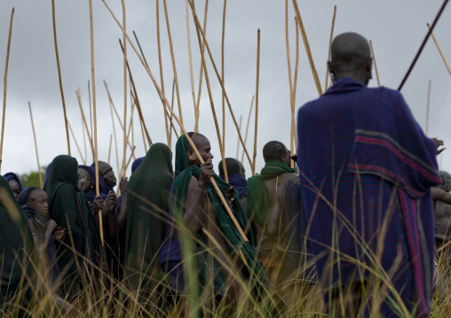 Suri tribe warriors fighting during a donga stick ritual, Omo valley, Tulgit, Ethiopia