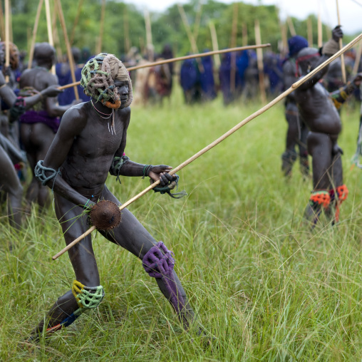 Suri tribe warriors fighting during a donga stick ritual, Omo valley, Tulgit, Ethiopia