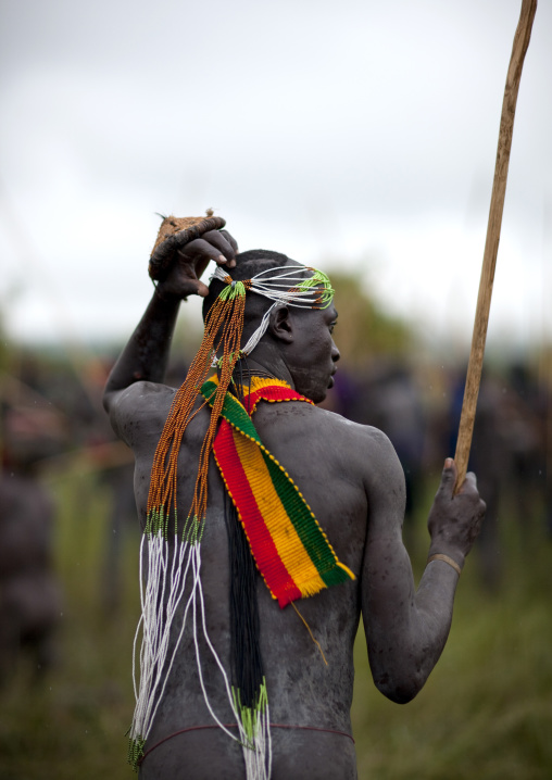 Suri tribe warriors fighting during a donga stick ritual, Omo valley, Tulgit, Ethiopia