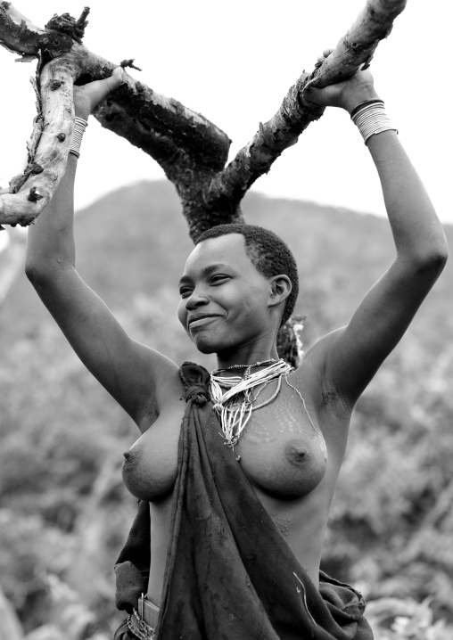 Surma Woman Carrying Tree Branches, Omo Valley, Ethiopia