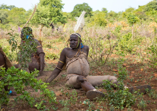 Bodi tribe fat men resting during Kael ceremony, Omo valley, Hana Mursi, Ethiopia