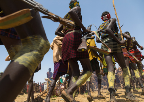 Men with weapons during the proud ox ceremony in the Dassanech tribe, Turkana County, Omorate, Ethiopia