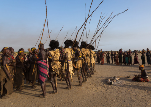 Dassanech men with leopard skins and ostrich feathers wigs during Dimi ceremony to celebrate circumcision of teenagers, Turkana County, Omorate, Ethiopia