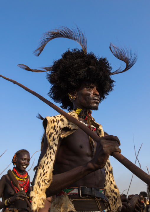 Dassanech men with leopard skins and ostrich feathers wigs during Dimi ceremony to celebrate circumcision of teenagers, Turkana County, Omorate, Ethiopia