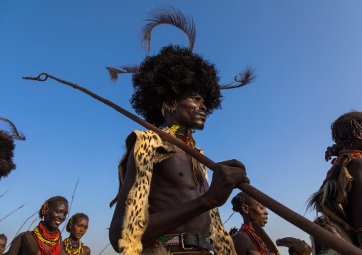 Dassanech men with leopard skins and ostrich feathers wigs during Dimi ceremony to celebrate circumcision of teenagers, Turkana County, Omorate, Ethiopia