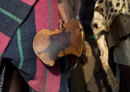 Dassanech tribe man holding his wooden pillow, Turkana County, Omorate, Ethiopia