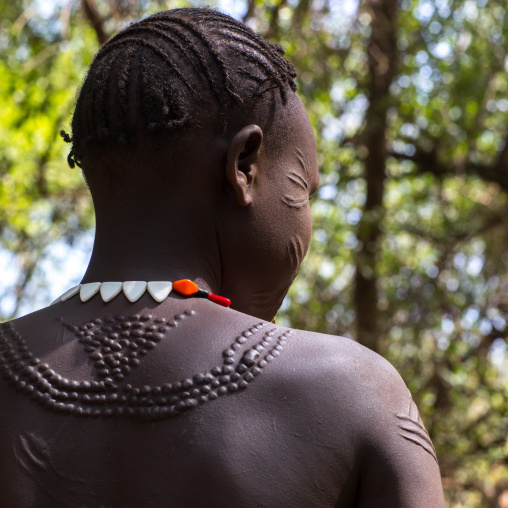 Sudanese Toposa tribe woman refugee with scarifications on her body, Omo Valley, Kangate, Ethiopia